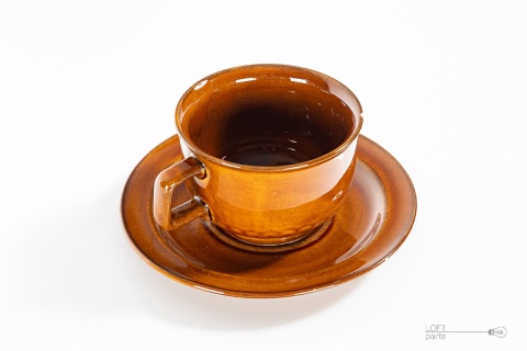 porcelitowa filiżanka ze spodkiem chodzież